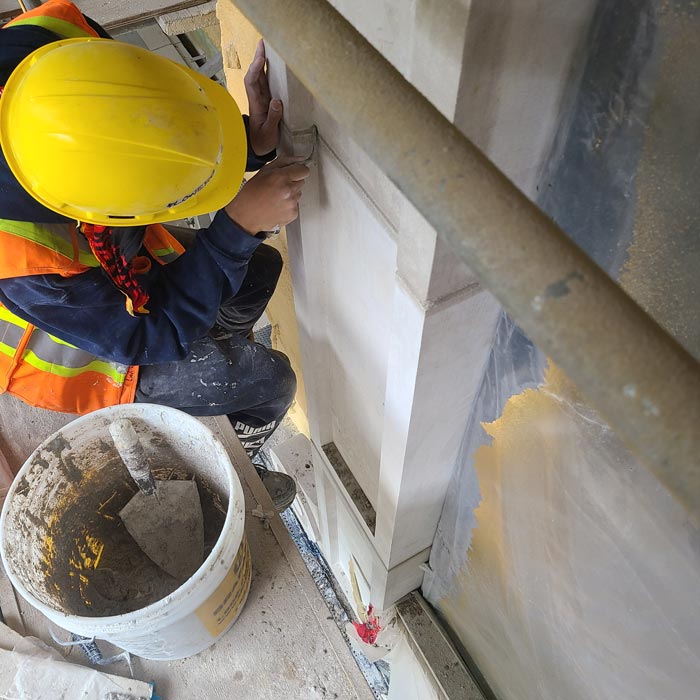 worker repairing concrete